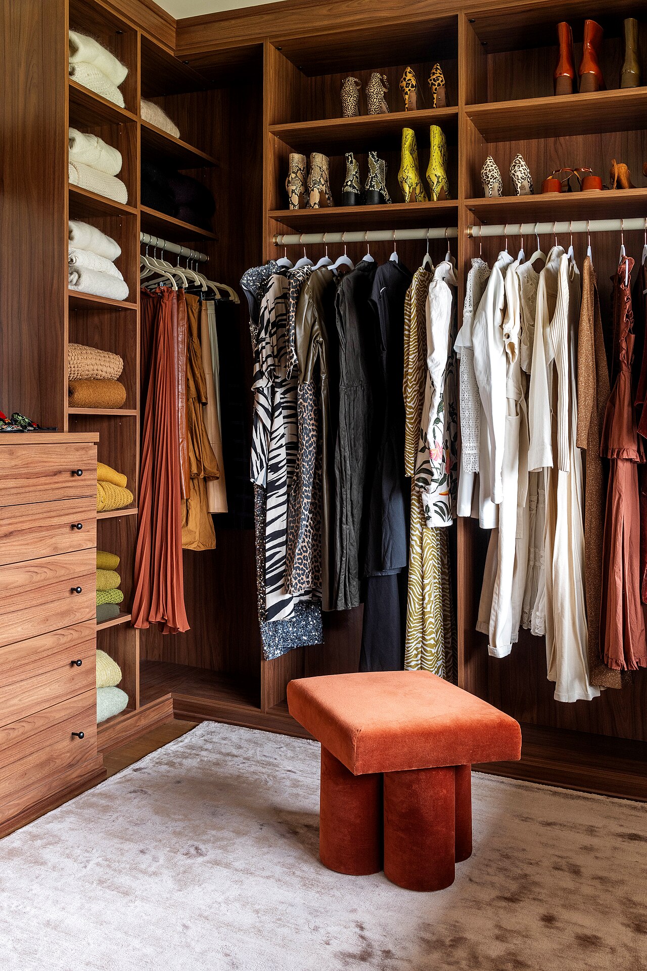 Walk-in closet with wood shelving